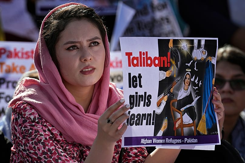 FILE: An Afghan woman takes part in a rally to mark International Women's Day, in Islamabad, Pakistan, 8 March 2023