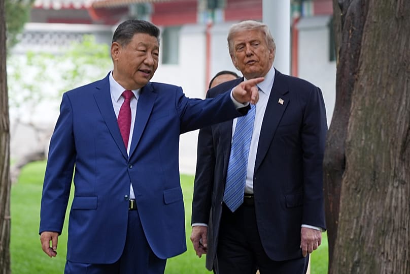 FILE: US President Donald Trump talks with China's President Xi Jinping at the Zhongnanhai leadership compound in Beijing, 15 May 2026