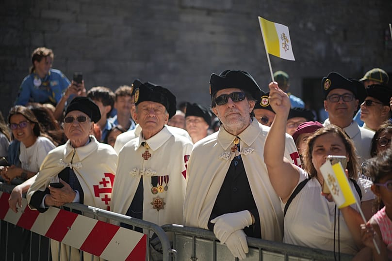 The faithful wait for Pope Leo XIV outside the Basilica during his visit to San Marino