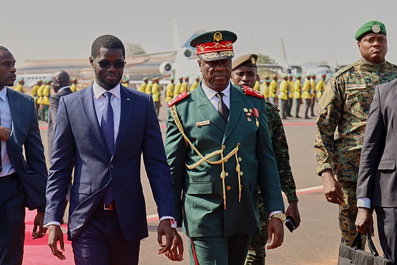 FILE - The Transitional President of Guinea-Bissau, General Horta Inta-A-Na Man, centre, and the President of Senegal, Bassirou Diomaye Faye