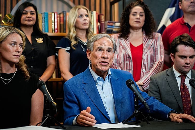 Texas Governor Greg Abbott speaks at a press conference in Austin, August 18. (Sara Diggins/The San Antonio Express-News via AP)