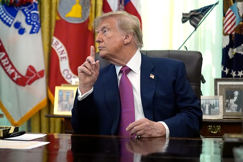 US President Donald Trump gestures in the Oval Office of the White House, 27 August, 2026