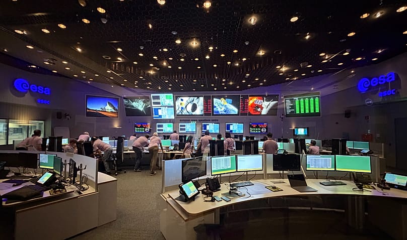 FILE - The BepiColombo Mercury arrival phase mission control team in the main control room at the European Space Operations Centre (ESOC).