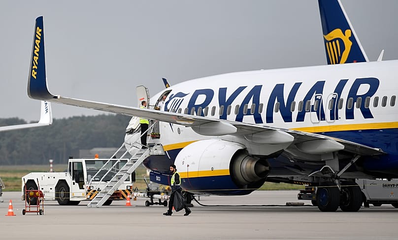 FILE - In this Sept. 12, 2018 file photo, a Ryanair plane parks at the airport in Weeze, Germany.