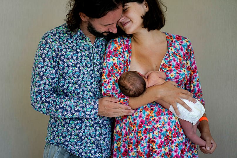 Maxim Levoshin and his wife Yekaterina Gordienko pose for a photo with their newborn son Leo in Buenos Aires, Argentina, on Saturday 18 February 2023.