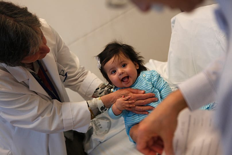 A doctor examines a five-month-old girl during a routine appointment at UCSF Benioff Children's Hospital on 16 March 2011 in San Francisco, USA.