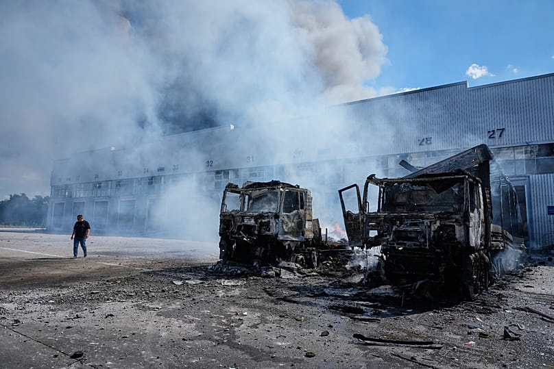 Vehicles burn in front of warehouses following a Russian air attack in Kyiv, 2 September, 2026