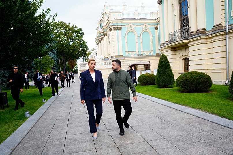 Denmark's Prime Minister Mette Frederiksen walks with Ukrainian President Volodymyr Zelenskyy in Kyiv, 23 August, 2026