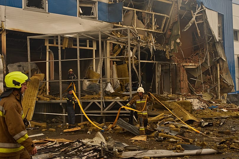 Firefighters try to extinguish a fire at a destroyed pharmaceutical warehouse after Russian drone attacks on the outskirts of Kyiv, 3 September, 2026