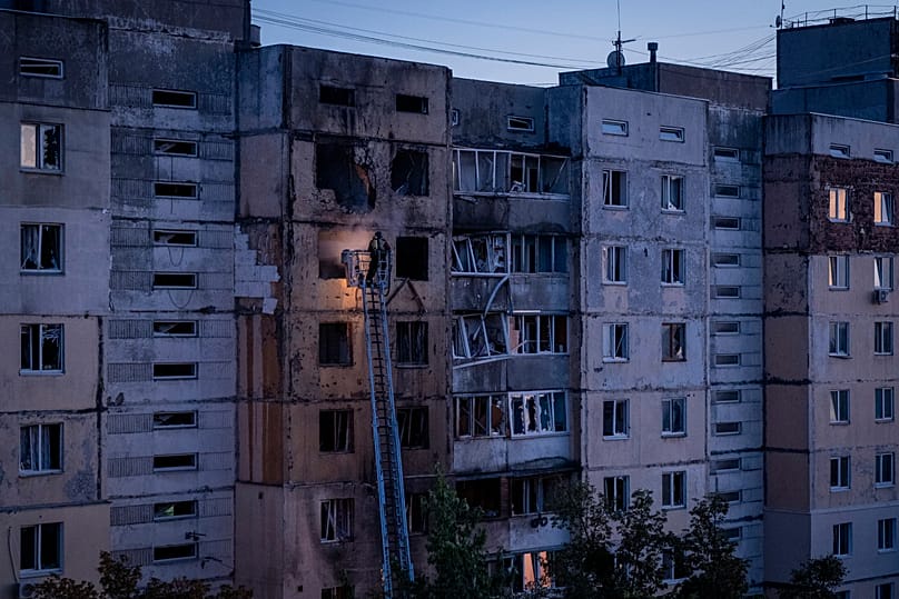 Firefighters work at a residential building after a Russian drone attack struck in the Holosiivskyi district of Kyiv, 3 September, 2026