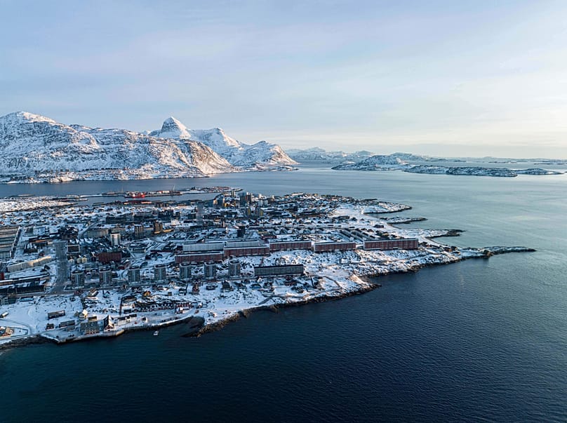 Houses are seen near the coast of a sea inlet of Nuuk, Greenland, on Sunday, Jan. 25, 2026.