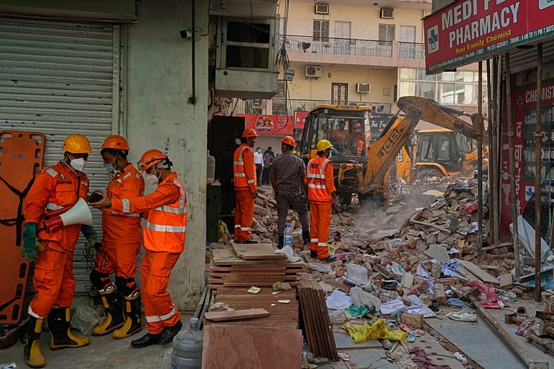 Rescue workers continue to search for people trapped under the debris of a collapsed building in New Delhi, 7 September, 2026