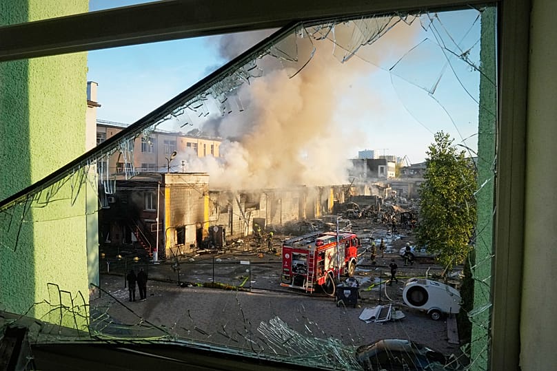 Firefighters work on the site of a burning building after a Russian missile attack in Kyiv, 8 September, 2026