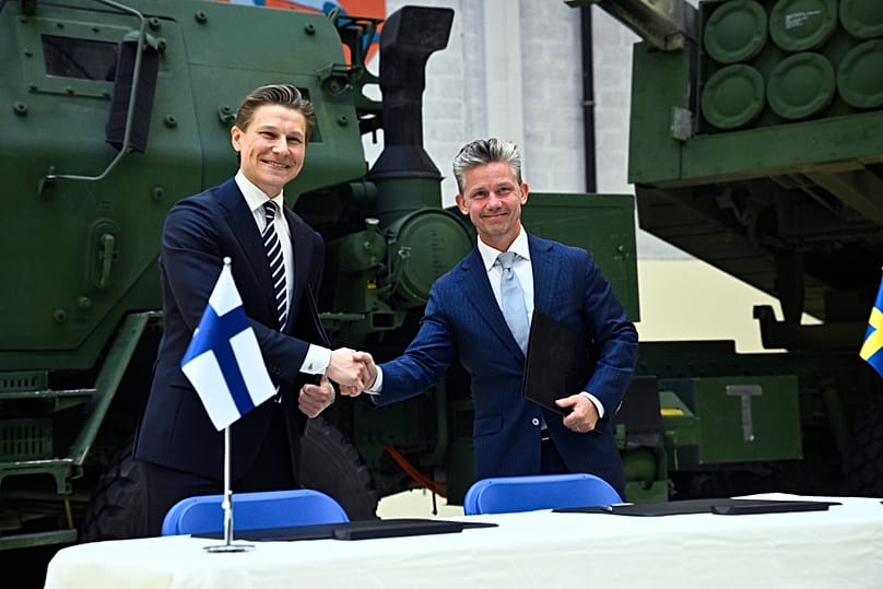 FILE. Finland's Defence Minister Antti Häkkänen and Sweden's Defence Minister Pål Jonson shake hands after signing the agreement, 7 Sept. 2026