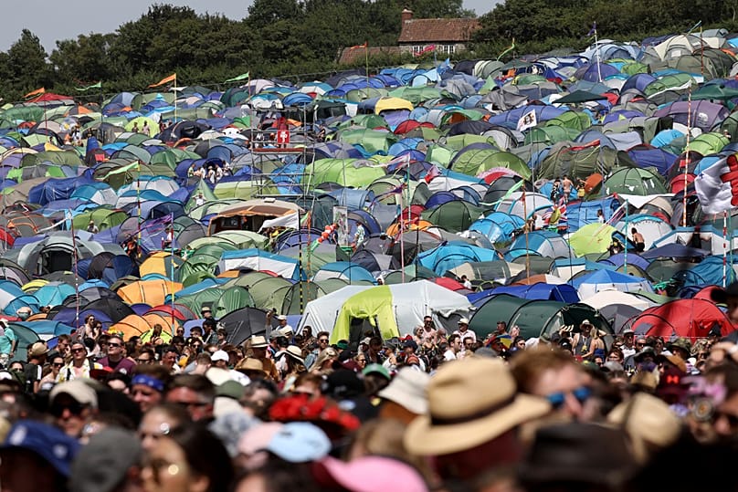 Revellers surrounding the Pyramid Stage at the Glastonbury Festival - 2019