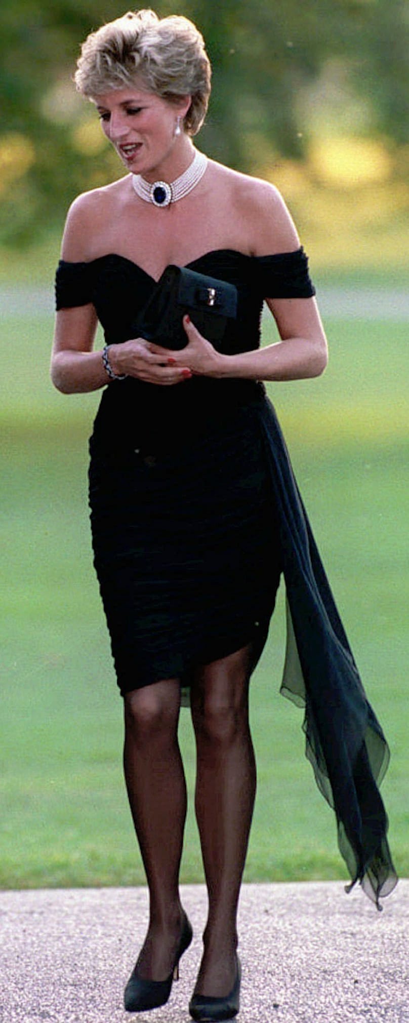 FILE - Diana, Princess of Wales walks during a party given at the Serpentine Gallery in London. The same day that Charles admitted he was unfaithful to Diana on TV