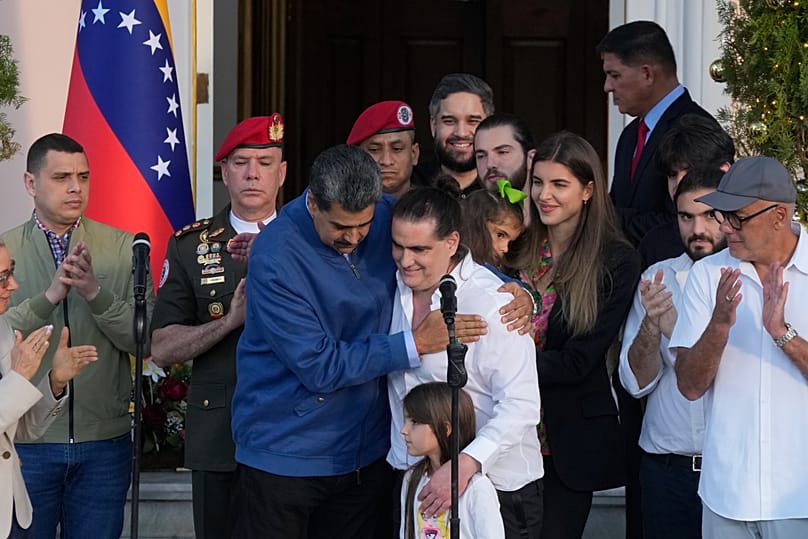Venezuelan President Maduro, center left, embraces Alex Saab after Saab arrived at Miraflores presidential palace in Caracas, Venezuela, Wednesday, Dec. 20, 2023. 