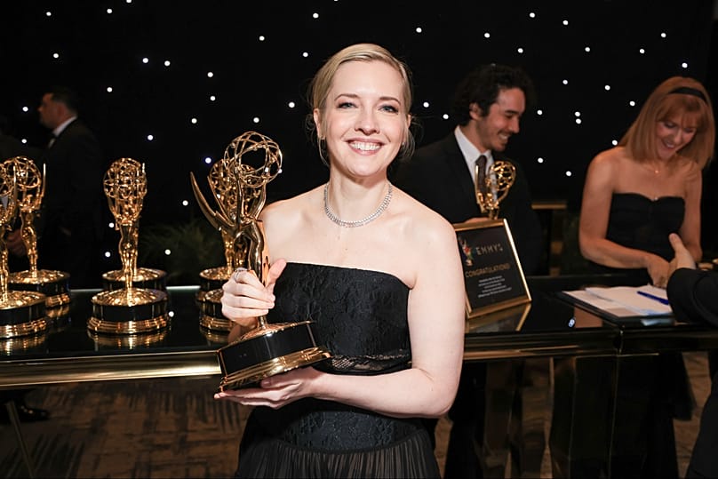 Katie Dippold pics up the official Emmy statuette for Widow's Bay during the Television Academy's 78th Emmy Awards, Sep 14, 2026