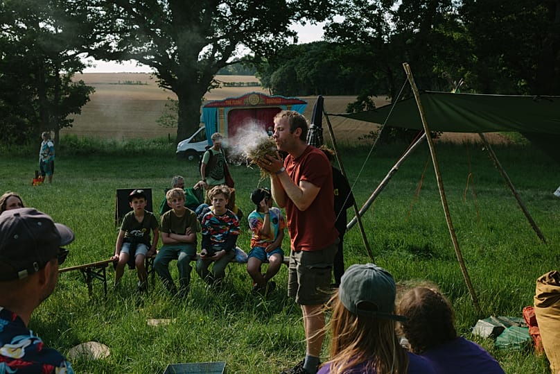 Jim Todd, co-founder of Bushcraft Bus, demonstrates fire making.