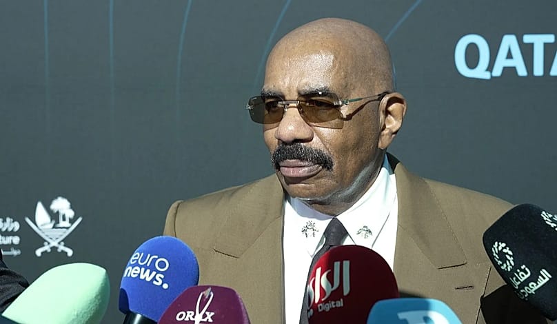 American TV host and comedian Steve Harvey speaks during the launch of the Qatar Calendar 2026-2027