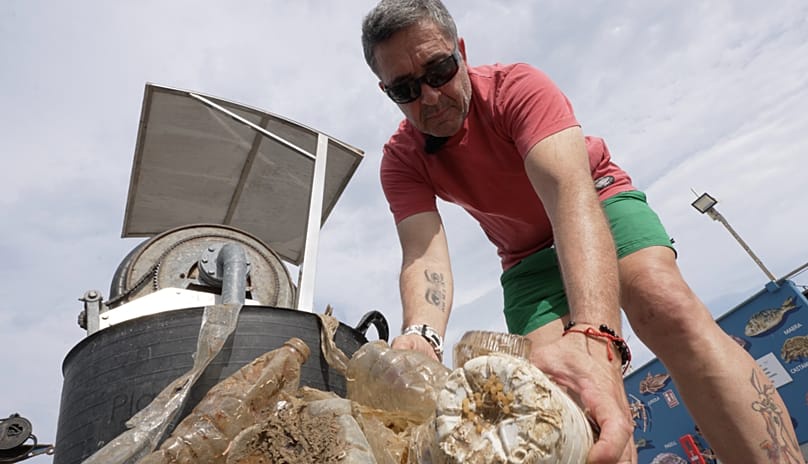 Fisherman Tony Beltrán showing some of the waste caught in the nets off the coast of Gandía, south of Valencia. September 2026.