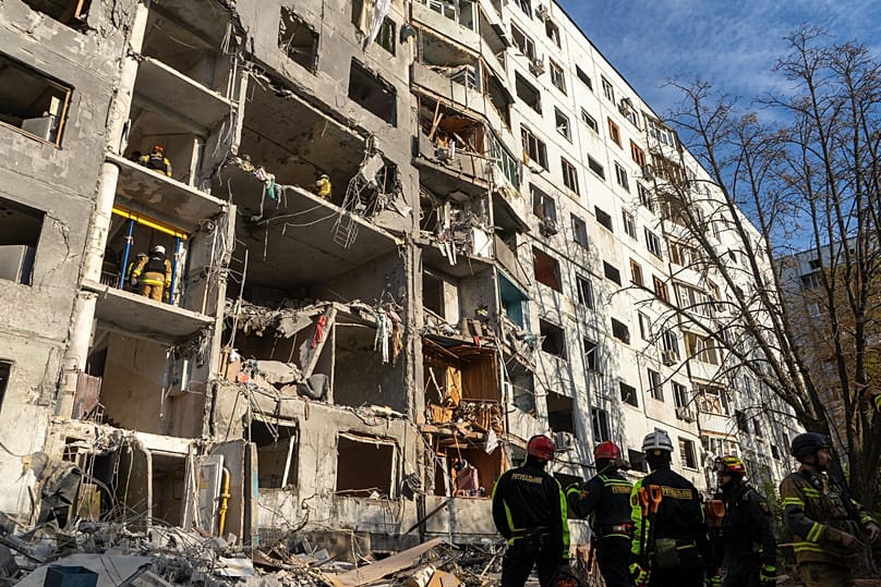 Rescue workers clear the rubble from a residential house damaged in a Russian strike on Kharkiv, 28 September, 2026