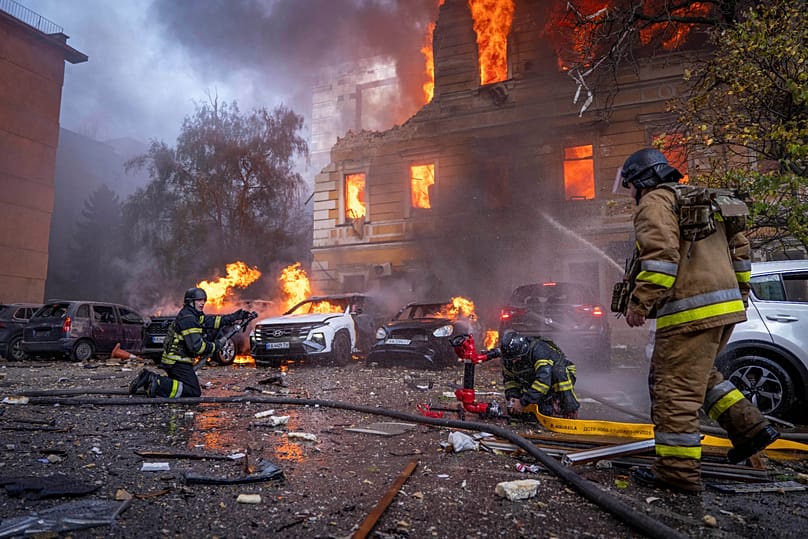 Rescue workers put out a fire at the National Academy of Sciences building damaged after a Russian drone strike in Kyiv, 28 September, 2026