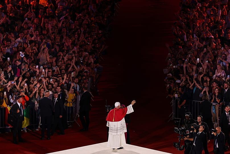 Pope Leo XIV waves after a prayer vigil with young people at the Stade de France in Saint-Denis near Paris, Friday, Sept. 25, 2026.
