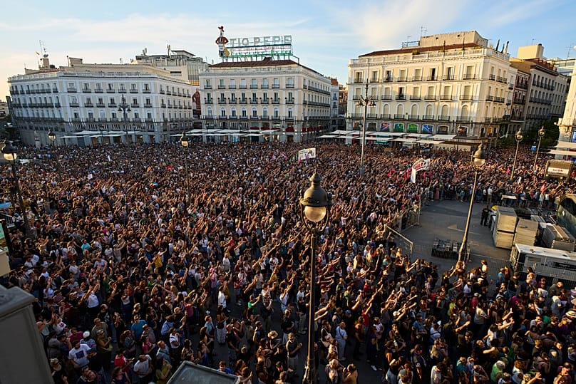 People gather during a protest following the eviction last Wednesday of 87-year-old Maricarmen demand stronger laws to protect renters at Puerta del Sol in Madrid,26.09.2026