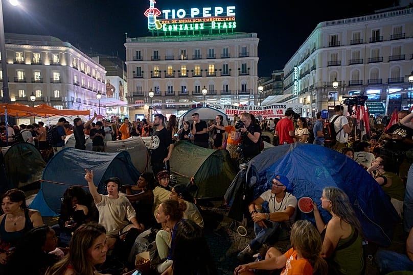 People set up tents during a protest following the eviction last Wednesday of 87-year-old Maricarmen to demand stronger laws to protect renters at Sol square in Madrid, Spain,