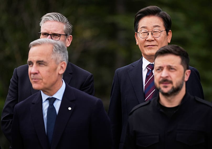Lee Jae-myung and Volodymyr Zelenskyy pose for photos alongside Canada's Carney and UK's Starmer at the G7 Summit in Alberta, Canada, Tuesday, June 17, 2025