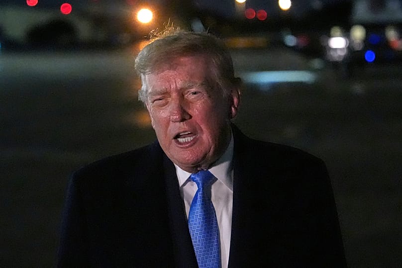 US President Donald Trump speaks with reporters upon arriving, Sunday, Sept. 27, 2026, at Joint Base Andrews, Maryland