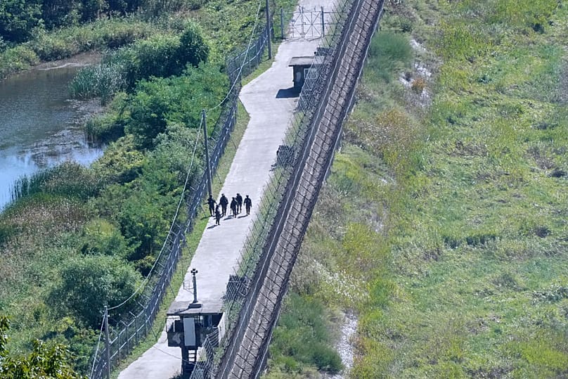 South Korean army soldiers patrol along the barbed-wire fence near the border with North Korea in Paju, 29 September, 2026