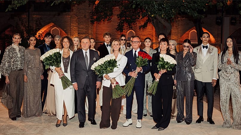 Models, organisers and guests pose for a group photograph at Brunello Cucinelli’s Fall-Winter 2026 fashion show at the Abulkasim Madrasah in Tashkent, Uzbekistan