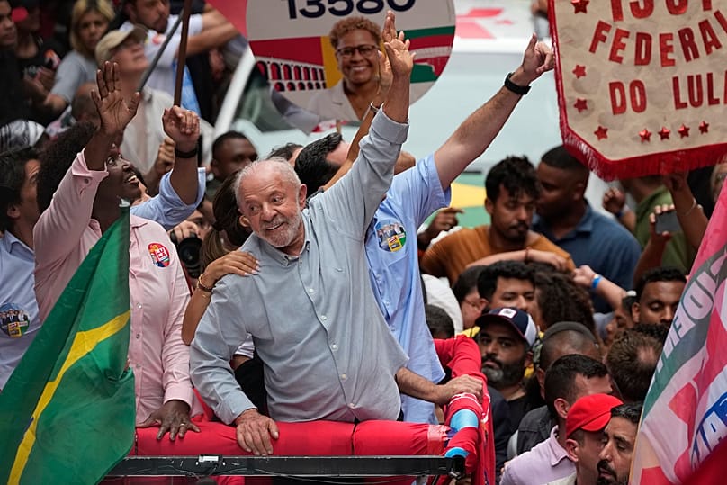 Brazilian President Luiz Inacio Lula da Silva, who is running for reelection, waves to supporters during a campaign rally in Rio de Janeiro, Brazil on 2 October 2026.