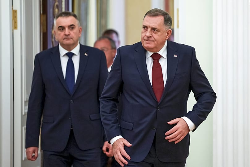 Bosnian Serb leader Milorad Dodik, right, and Prime Minister of Republika Srpska Savo Minic enter a hall for the talks with Russian President Vladimir Putin at the Kremlin.