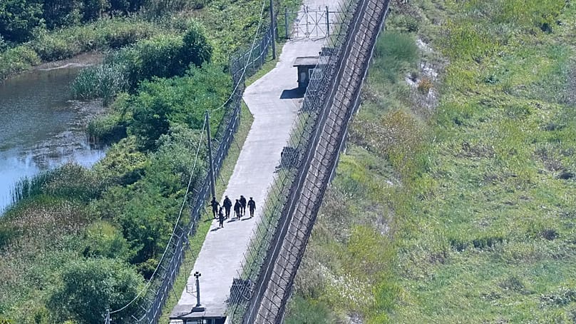 South Korean army soldiers patrol along the barbed-wire fence near the border with North Korea, in Paju, South Korea, Tuesday, Sept. 29, 2026. (AP