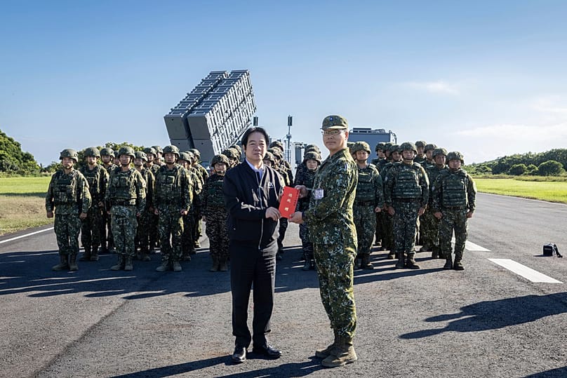 Taiwan's President William Lai Ching-te poses for photos with soldiers during an inspection of a missile base in Pingtung county in southern Taiwan on Friday, Sep. 18, 2026