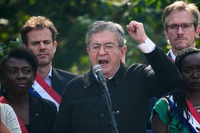 French far-left leader Jean-Luc Melenchon attends a demonstration in protest of the government's release of next year's draft budget, in Paris, Tuesday, Sept. 29, 2026
