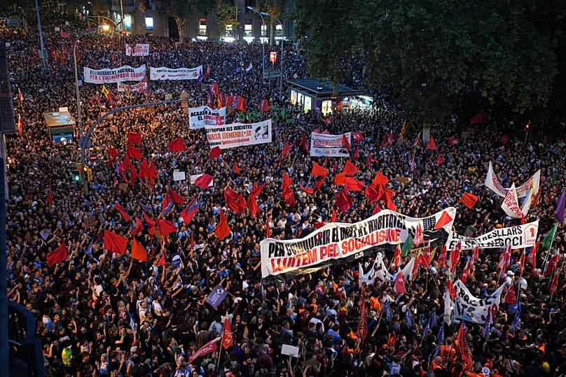 Tens of thousands march protesting the housing situation in Spain just hours after Pedro Sánchez announced an early general election, in Barcelona, Spain, Monday, Oct. 5, 2026