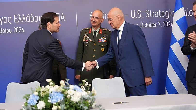 U.S. Secretary of State Marco Rubio, left, shakes hands with Greek Defense Minister Nikos Dendias