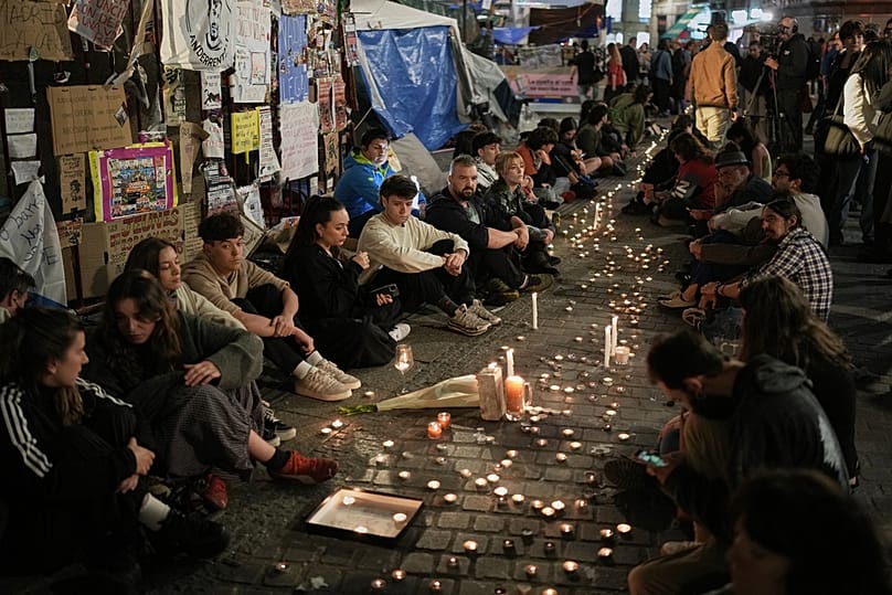 Protesters gather after the reported death of María del Carmen Abascal, the 87-year-old woman whose eviction sparked nationwide protests, Madrid, Wednesday, Oct. 7, 2026