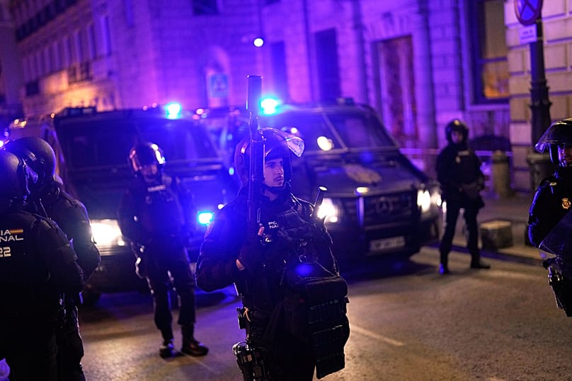 Police officers cordon off the area as protesters gather near the Parliament after the reported death of 87-year-old María del Carmen Abascal, Madrid, Wednesday, Oct. 7, 2026