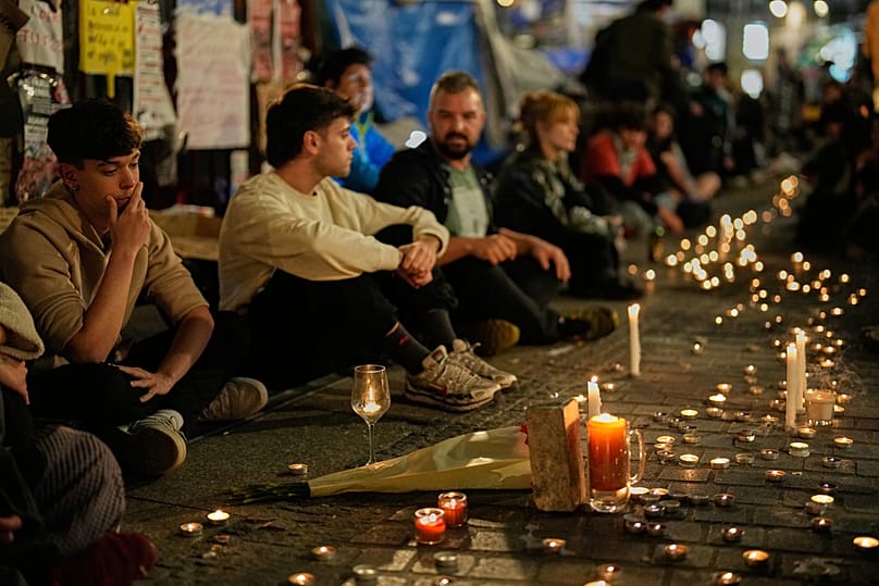 Protesters gather after the reported death of María del Carmen Abascal, the 87-year-old woman whose eviction sparked nationwide protests, Madrid, Wednesday, Oct. 7, 2026