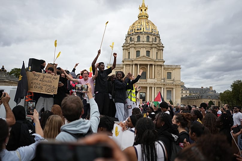 Students chant during a march to protest against under-resourced schools in Paris, Tuesday Oct. 13, 2026.