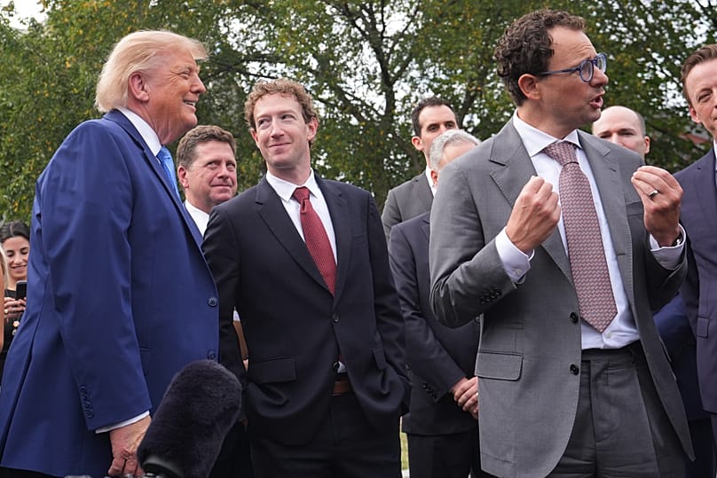 FILE. US President Donald Trump and Meta CEO Mark Zuckerberg listen as Anthropic CEO Dario Amodei speaks to reporters at the White House, 29 Sept. 2026