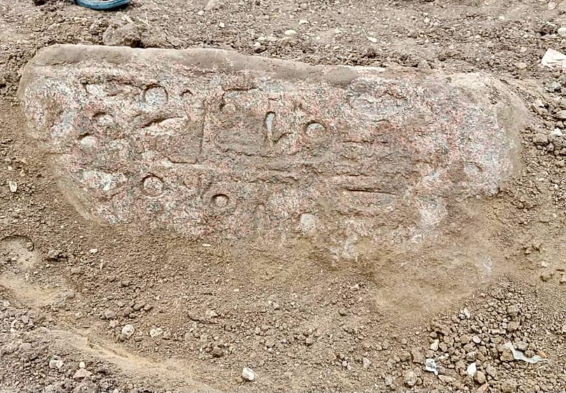Ancient Egyptian inscriptions on a stone block recovered at the excavation site.