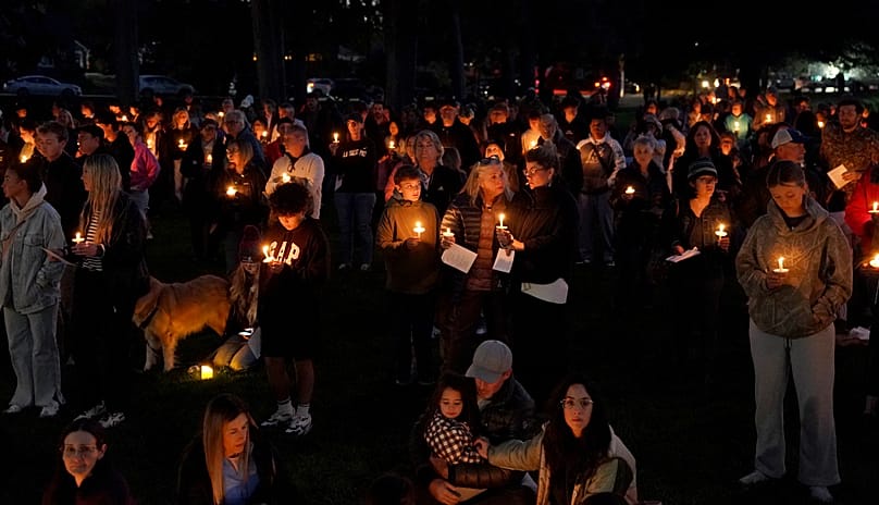 People gather for a candlelight vigil held in Drake Park in Bend, 15 October, 2026