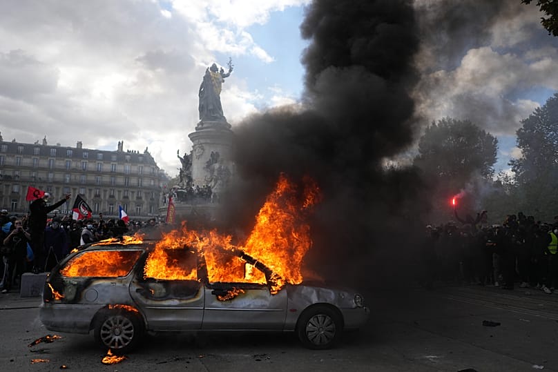 A car burns in Place de la République on 17 October 2026.