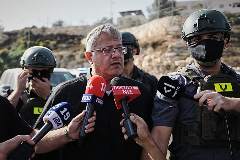 Israeli National Security Minister Itamar Ben-Gvir speaks to the media at the scene of a shooting  near Hebron 
